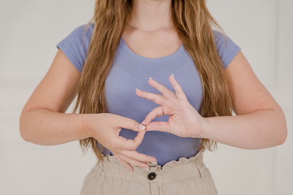 Hands demonstrating a finger muscle-testing technique